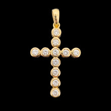 Load image into Gallery viewer, A round diamond cross pendant in yellow gold, on a black background
