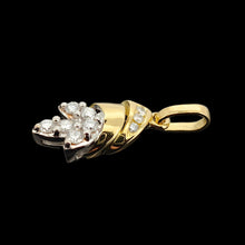 Load image into Gallery viewer, A yellow and white gold diamond set leaf shaped pendant, on a black background
