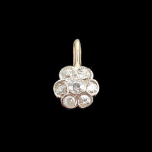Load image into Gallery viewer, A flower shaped diamond cluster pendant in yellow gold and platinum, on a black background
