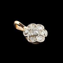 Load image into Gallery viewer, A flower shaped diamond cluster pendant in yellow gold and platinum, on a black background
