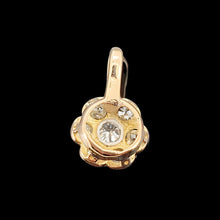 Load image into Gallery viewer, A flower shaped diamond cluster pendant in yellow gold and platinum, on a black background

