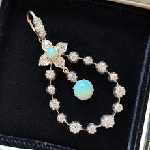 Load image into Gallery viewer, A pear shaped open pendant set with opals and diamonds, in gold and silver
