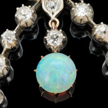 Load image into Gallery viewer, Close-up of an opal and diamond pendant in silver and gold
