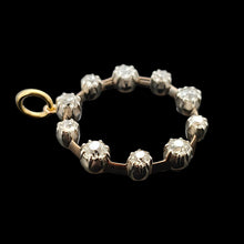 Load image into Gallery viewer, A ten stone old cut diamond open circle pendant in silver and gold
