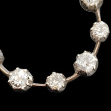 Load image into Gallery viewer, A ten stone old cut diamond open circle pendant in silver and gold, close-up
