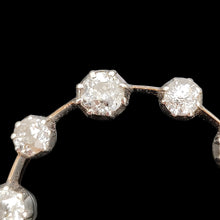 Load image into Gallery viewer, A ten stone old cut diamond open circle pendant in silver and gold, close-up
