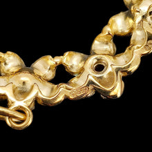 Load image into Gallery viewer, Close-up of a 9 carat gold hallmark on the back of a yellow gold flower pendant

