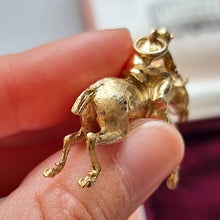 Load image into Gallery viewer, Vintage 9ct Gold Horse and Jockey Pendant, Hallmarked London 1976 in hand

