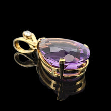 Load image into Gallery viewer, A pear shaped amethyst pendant with a single diamond in yellow gold, against a black background
