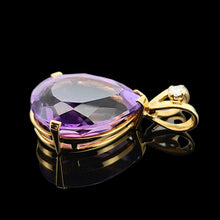 Load image into Gallery viewer, A pear shaped amethyst pendant with a single diamond in yellow gold, against a black background
