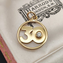 Load image into Gallery viewer, A yellow gold 30 pendant with a brilliant cut diamond, in an antique Harrods box
