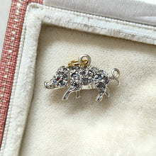 Load image into Gallery viewer, A diamond and ruby set silver pig charm with a gold jump ring, in an antique box
