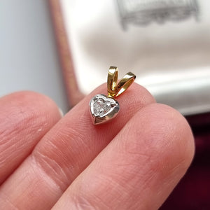 18ct Yellow & White Gold Heart Diamond Pendant in hand