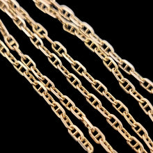 Load image into Gallery viewer, Gold chain on a black background
