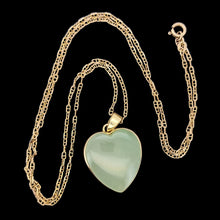 Load image into Gallery viewer, Necklace with a heart-shaped pendant on a black background

