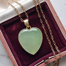 Load image into Gallery viewer, Heart-shaped green jade pendant on a gold chain in an antique jewellery box
