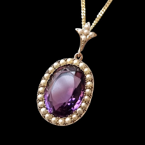 Antique 9ct Gold Amethyst and Seed Pearl Cluster Pendant on a black background