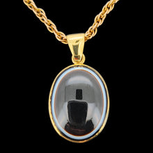 Load image into Gallery viewer, An oval banded agate pendant rubover set in yellow gold, with a yellow gold chain
