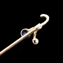 Load image into Gallery viewer, A sapphire and pearl tie pin in yellow gold, on a black background
