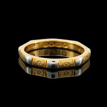 Load image into Gallery viewer, An eight sided band ring in gold and platinum with floral engraving, on a black background
