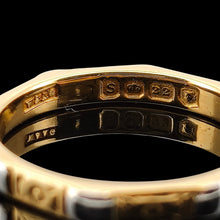Load image into Gallery viewer, An eight sided band ring in gold and platinum with floral engraving, hallmarked 22ct gold London 1953, on a black background
