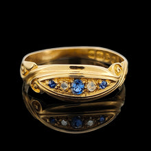 Load image into Gallery viewer, A yellow gold five stone sapphire and diamond ring, on a black background
