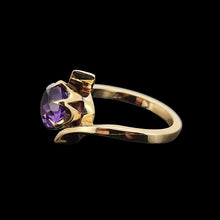 Load image into Gallery viewer, Gold ring with an amethyst on a black background

