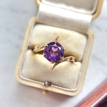 Load image into Gallery viewer, Gold ring with an amethyst in an antique ring box on a light background
