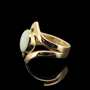 Vintage 9ct Yellow Gold Opal Crossover Dress Ring side view, on a black background