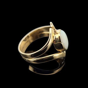 Vintage 9ct Yellow Gold Opal Crossover Dress Ring side view, on a black background