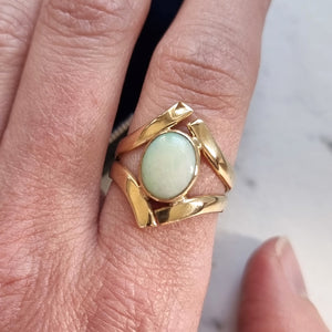 Vintage 9ct Yellow Gold Opal Crossover Dress Ring modelled on the index finger