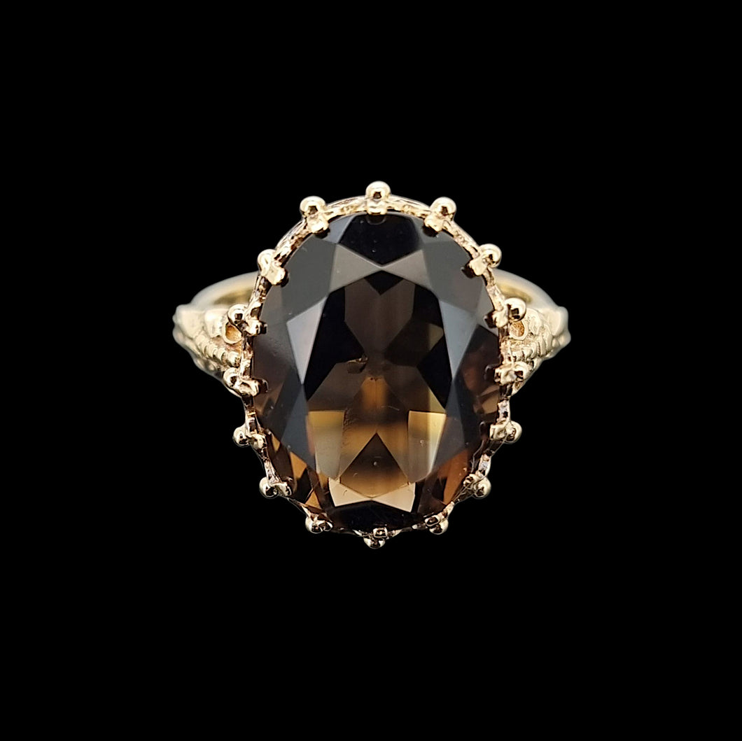 Vintage 9ct Yellow Gold Smokey Quartz Dress Ring on a black background