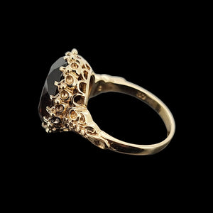 Vintage 9ct Yellow Gold Smokey Quartz Dress Ring shown from the side, on a black background