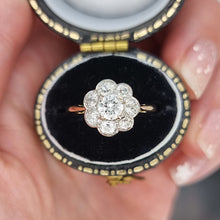Load image into Gallery viewer, Diamond ring in an open ring box held by a hand
