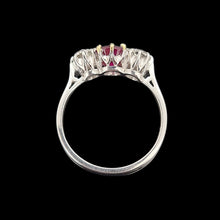 Load image into Gallery viewer, Side view of a white gold three stone ring, on a black background

