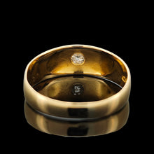 Load image into Gallery viewer, A solitaire old cut diamond gypsy set ring in yellow gold, on a black background
