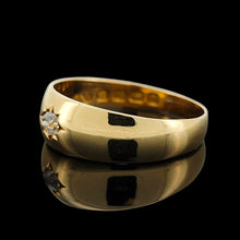 Load image into Gallery viewer, A solitaire old cut diamond gypsy set ring in yellow gold, on a black background
