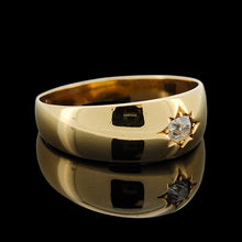 Load image into Gallery viewer, A solitaire old cut diamond gypsy set ring in yellow gold, on a black background
