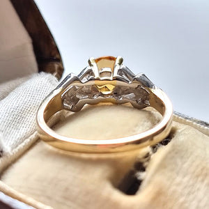 18ct Gold Topaz and Baguette-Cut Diamond Ring behind
