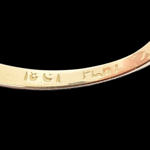 Vintage 18ct Gold and Platinum Diamond Ring with Diamond Shoulders, 0.33ct close-up of the 18CT PLAT stamp inside the shank, on a black background