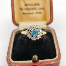 Load image into Gallery viewer, A blue zircon and diamond flower cluster ring in yellow and white gold, in an antique ring box
