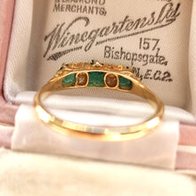 Load image into Gallery viewer, Vintage 18ct Gold Emerald and Diamond Carved Half Hoop Ring behind head
