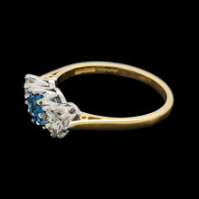 Load image into Gallery viewer, A three stone blue zircon and diamond ring in yellow and white gold
