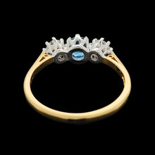Load image into Gallery viewer, A three stone blue zircon and diamond ring in yellow and white gold
