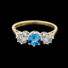 Load image into Gallery viewer, A three stone blue zircon and diamond ring in yellow and white gold
