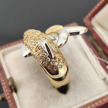 Load image into Gallery viewer, A yellow and white gold dolphin ring with diamonds and ruby eyes, in an antique ring box
