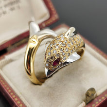 Load image into Gallery viewer, A yellow and white gold dolphin ring with diamonds and ruby eyes, in an antique ring box
