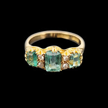 Load image into Gallery viewer, Gold ring with emerald and diamond accents on a black background
