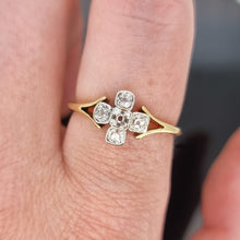 Load image into Gallery viewer, Gold ring with diamond accents on a finger against a neutral background
