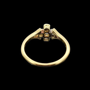 Gold ring with diamonds on a black background